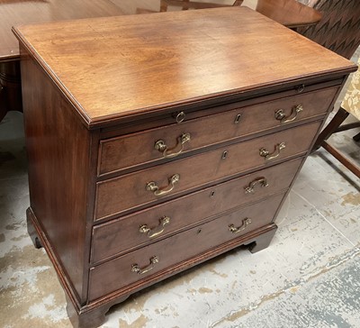 Lot 1223 - George III mahogany chest of drawers with brushing slide and four long graduated drawers with brass swan neck handles and cock beaded edge on bracket feet, 85cm wide