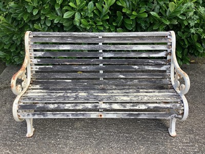 Lot 1226 - Victorian style cast iron garden bench with wooden slats