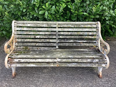 Lot 1227 - Victorian style cast iron garden bench with wooden slats