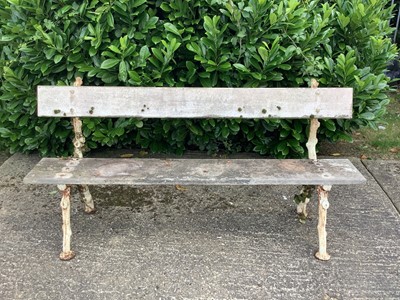 Lot 1228 - Victorian cast iron garden bench with rustic branch design and wooden slats