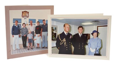 Lot 47 - H.M.Queen Elizabeth II and H.R.H.The Duke of Edinburgh, two signed 1982 and 1983 Christmas cards with twin gilt Royal ciphers to interiors and colour photographs of the Royal Family to fronts (2)
