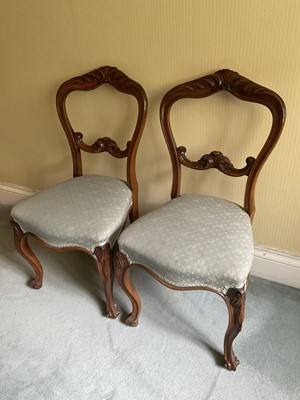 Lot 1230 - Set of six mid Victorian carved walnut dining chairs, each with arched carved back on cabriole legs