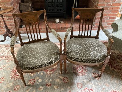 Lot 1233 - Pair of Edwardian satinwood and polychrome painted elbow chairs, each with tablet back and stuffover seat on fluted legs