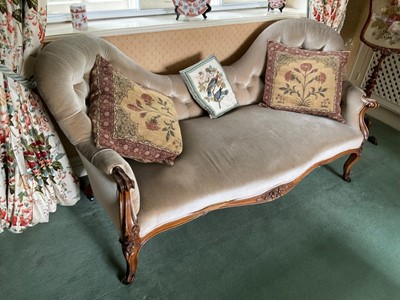 Lot 1237 - Victorian two seater settee, with undulating button upholstered back and seat and floral carved walnut showood frame on castors, approximately 156cm wide