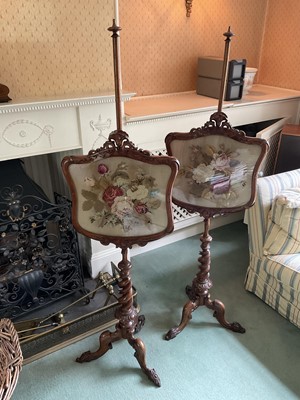 Lot 1243 - Rare pair of Victorian walnut pole screens, each with shaped foliate inlaid glazed banner rising on graduated barley twist column and cabriole legs, 148cm high