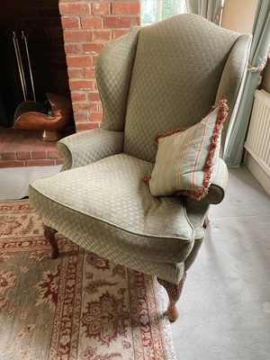 Lot 1249 - Modern wing back armchair, with chequer upholstery, raised on carved cabriole legs