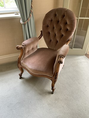 Lot 1252 - Victorian button back armchair, with teardrop shaped back raised on carved walnut showood frame with cabriole legs and castors
