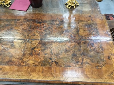 Lot 1257 - Impressive early 18th century Italian figured walnut crossbanded and marquetry inlaid commode, the top with shaped angles, over four drawers, each with early paper lining, on tapered feet, a note i...