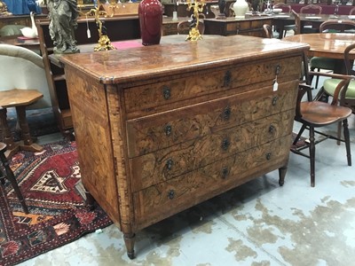 Lot 1257 - Impressive early 18th century Italian figured walnut crossbanded and marquetry inlaid commode, the top with shaped angles, over four drawers, each with early paper lining, on tapered feet, a note i...