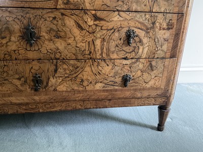 Lot 1257 - Impressive early 18th century Italian figured walnut crossbanded and marquetry inlaid commode, the top with shaped angles, over four drawers, each with early paper lining, on tapered feet, a note i...