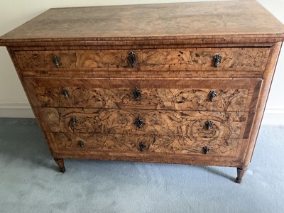 Lot 1257 - Impressive early 18th century Italian figured walnut crossbanded and marquetry inlaid commode, the top with shaped angles, over four drawers, each with early paper lining, on tapered feet, a note i...