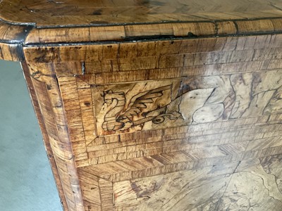 Lot 1257 - Impressive early 18th century Italian figured walnut crossbanded and marquetry inlaid commode, the top with shaped angles, over four drawers, each with early paper lining, on tapered feet, a note i...