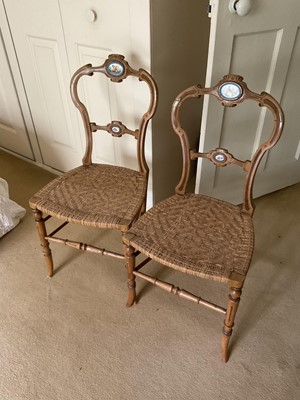 Lot 1266 - Pair of 19th century caned salon chairs with serves style porcelain plaque mounts