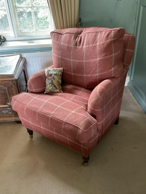 Lot 1268 - Modern upholstered armchair, with tartan upholstery on turned legs and castors