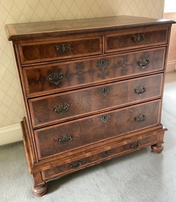 Lot 1271 - 17th century style laburnum oyster veneered chest on stand, late 17th century elements but with significant alternations, having concentric inlaid top, and two short over three graduated drawers on...