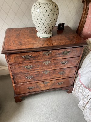 Lot 1273 - A near pair of 18th century style burr walnut crossbanded bedside chests, each with four graduated drawers on bracket feet, 73cm wide x 45cm deep x 102cm high