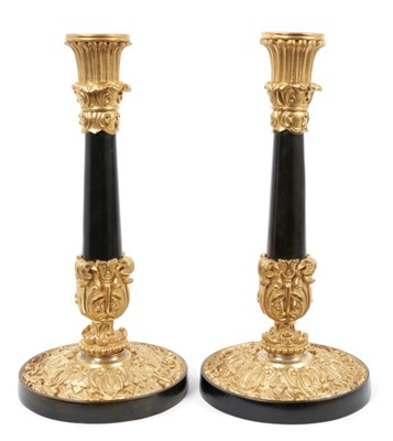 Lot 878 - Pair of 19th century bronzed and ormolu single candlesticks