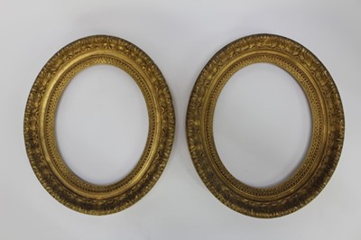 Lot 1198 - Pair of 19th century carved giltwood oval picture frames, 32cm x 25cm, 43cm x 37cm overall