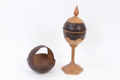 Lot 885 - Carved coconut basket decorated with the Royal arms, together with a carved coconut cup on stand (2)