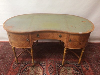 Lot 1381 - Good quality Edwardian satinwood kidney shape writing table with. Tooled leather inset top, central drawer flanked by cupboards on turned and reeded legs joined by stretchers terminating on brass c...