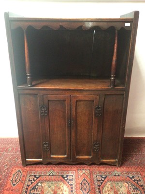 Lot 1388 - Unusual 18th century oak cupboard, the recess with shaped apron and turned baluster supports, the cupboard below enclosed by two panelled doors. 106cm wide x 151cm high x 45cm deep