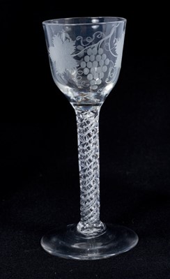 Lot 260 - 18th century wine glass with vine engraved bowl on air twist stem and splayed foot 14.4 cm
