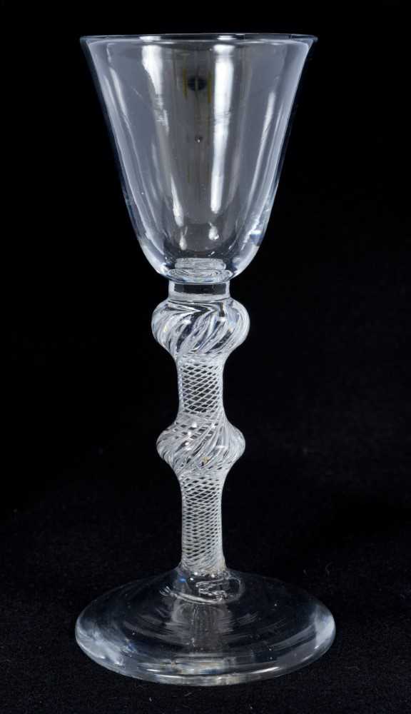 Lot 262 - 18th century wine glass with bell-shaped bowl, double knoped air twist stem on splayed foot 16 cm