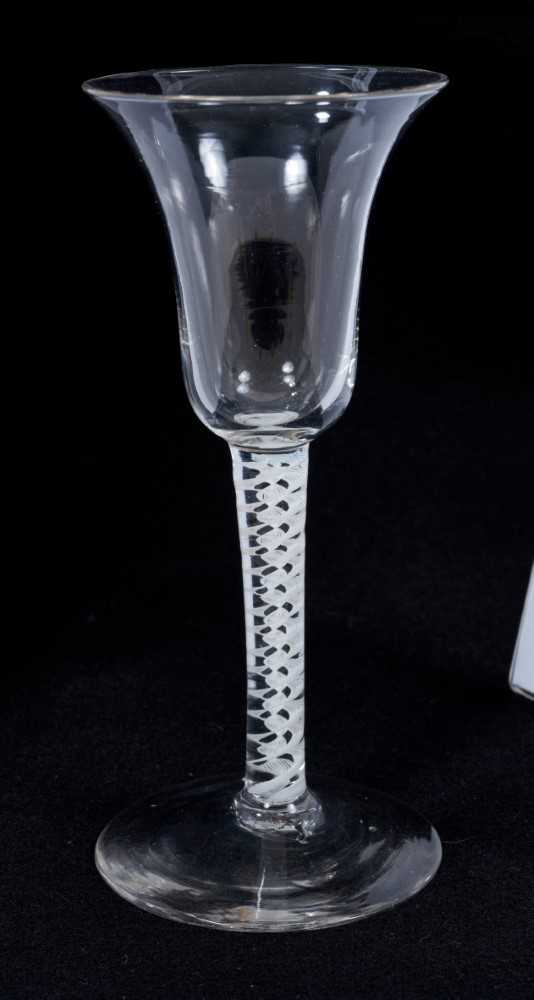 Lot 268 - 18th century wine glass with bell-shaped bowl on double opaque twist stem on splayed foot 17cm