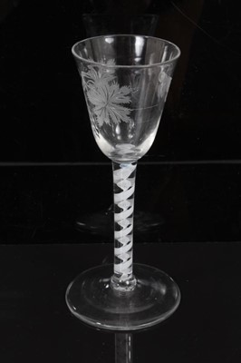 Lot 270 - 18th century wine glass with vine and butterfly engraved bowl, double opaque twist stem on splayed foot 15.6cm