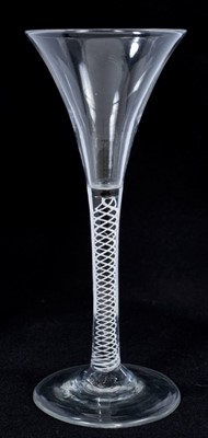Lot 271 - Georgian toasting glass of tall slender form with trumpet bowl, opaque twist stem on splayed foot 18cm