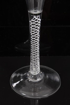 Lot 271 - Georgian toasting glass of tall slender form with trumpet bowl, opaque twist stem on splayed foot 18cm