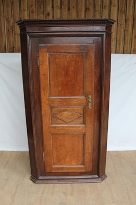 Lot 1286 - 18th century Anglo-French two height corner cupboard, with dentil cornice and geometric moulded panel door enclosing hanging space, 108cm wide x 62cm deep x 195cm high