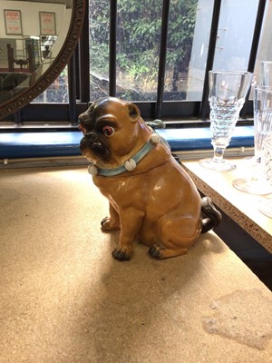 Lot 222 - Late 19th century Continental porcelain jar and cover in the form of a Meissen-style Pug dog with bells on his collar, 17.5cm high