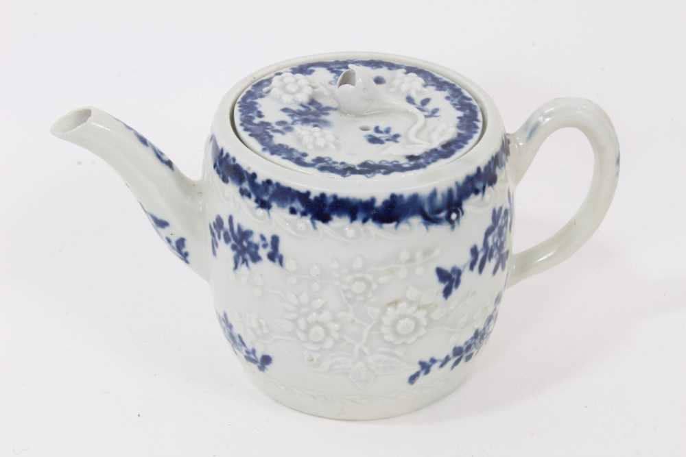 Lot 23 - A Worcester barrel-shaped teapot, circa 1775, relief-moulded and painted with floral patterns, ex-Zoresnky collection, 9.5cm high