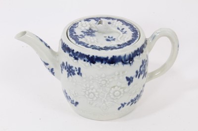 Lot 23 - A Worcester barrel-shaped teapot, circa 1775, relief-moulded and painted with floral patterns, ex-Zoresnky collection, 9.5cm high