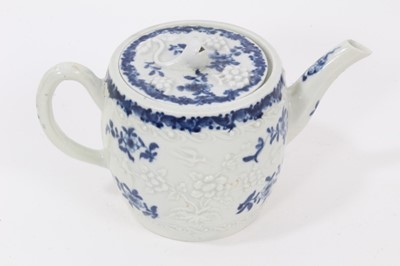 Lot 23 - A Worcester barrel-shaped teapot, circa 1775, relief-moulded and painted with floral patterns, ex-Zoresnky collection, 9.5cm high