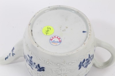 Lot 23 - A Worcester barrel-shaped teapot, circa 1775, relief-moulded and painted with floral patterns, ex-Zoresnky collection, 9.5cm high