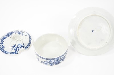 Lot 26 - A Worcester blue and white butter tub, cover and stand, circa 1770, decorated with floral sprays, 11cm diameter