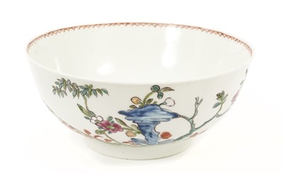 Lot 30 - An English porcelain bowl attributed to Vauxhall, circa 1755, polychrome painted in the Chinese style with flowers issuing from rockwork, 15cm diameter
