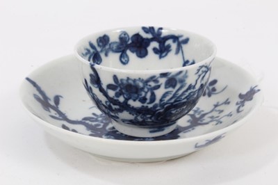 Lot 36 - A Worcester miniature blue and white teabowl and saucer, circa 1760, painted with the Prunus Root pattern, painter's marks, the saucer measuring 8.25cm diameter