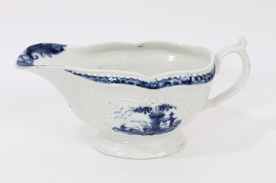 Lot 38 - A Worcester blue and white moulded sauceboat, circa 1760, painted with a variation of The Fisherman and Billboard Island pattern, crescent mark to base, 16cm long