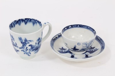 Lot 41 - A Caughley miniature blue and white tea bowl and saucer, circa 1780, decorated in the Island pattern, together with a miniature blue and white cup painted with flowers, probably Worcester (3)