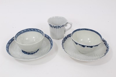 Lot 53 - Worcester blue and white moulded tea wares, circa 1780, including a tea bowl and saucer with floral moulding, and a cup, tea bowl and saucer (5)