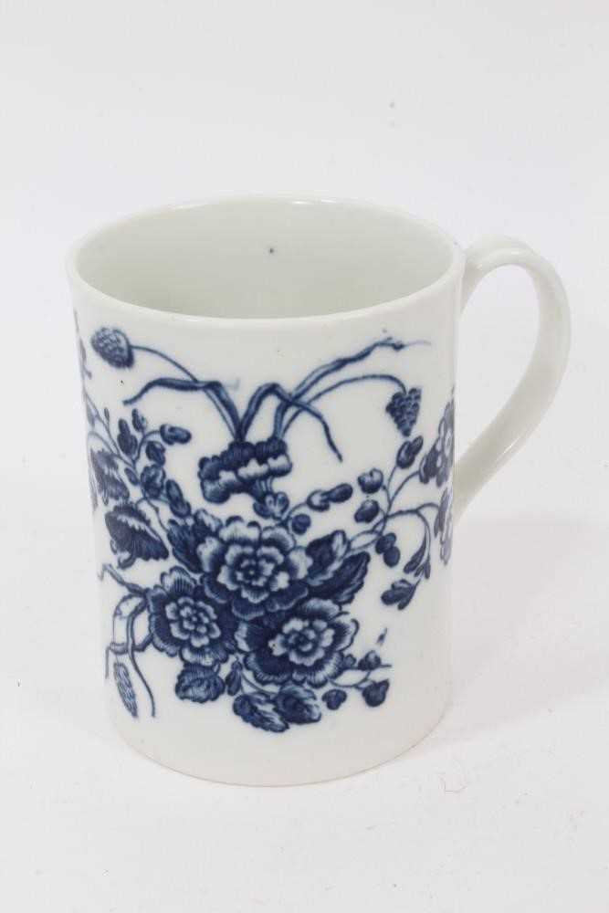 Lot 54 - A Caughley blue and white mug, printed with floral sprays, C mark to base, 8.5cm high