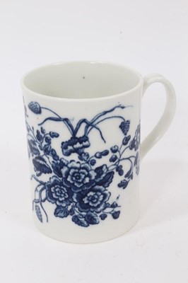 Lot 54 - A Caughley blue and white mug, printed with floral sprays, C mark to base, 8.5cm high