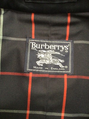Lot 2066 - Burberrys' London ladies navy trenchcoat size 16 long.