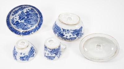 Lot 85 - A Chamberlains Worcester blue and white sucrier and trio, printed with Oriental landscapes (4)