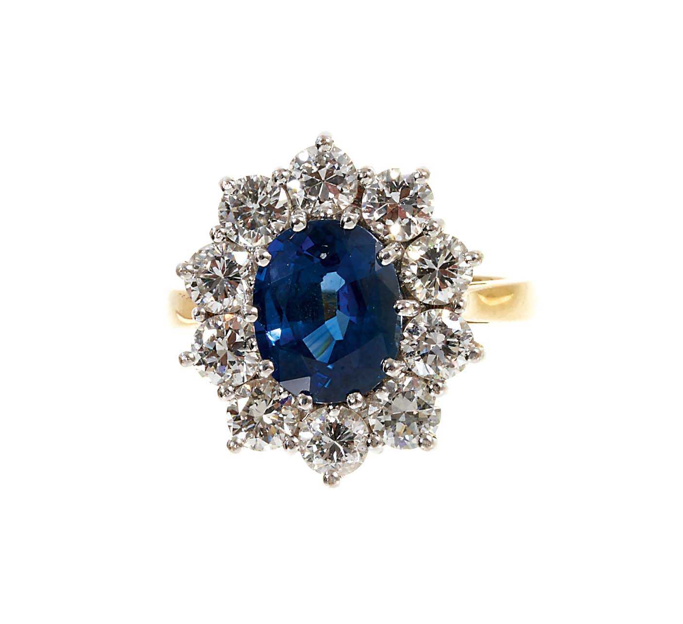 Lot 452 - Sapphire and diamond cluster ring