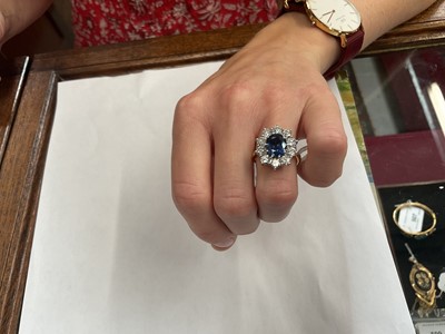 Lot 452 - Sapphire and diamond cluster ring