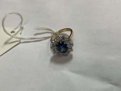 Lot 452 - Sapphire and diamond cluster ring